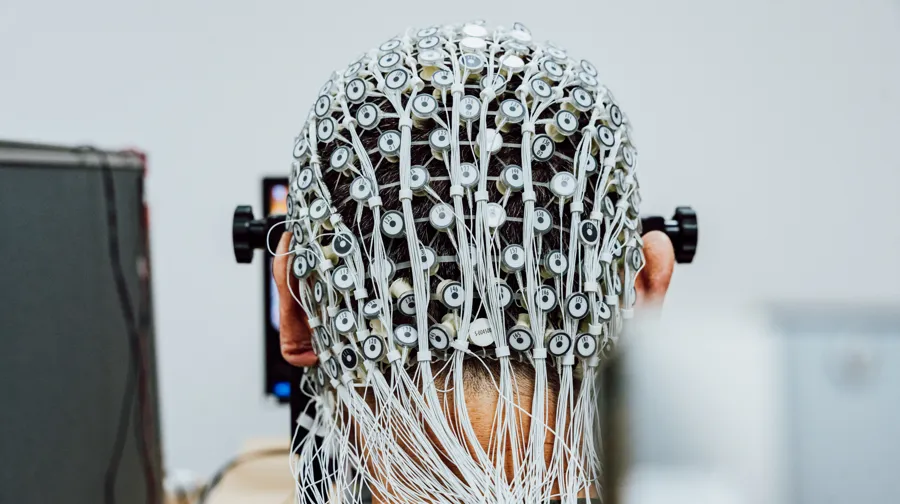 A man with wires on his head.