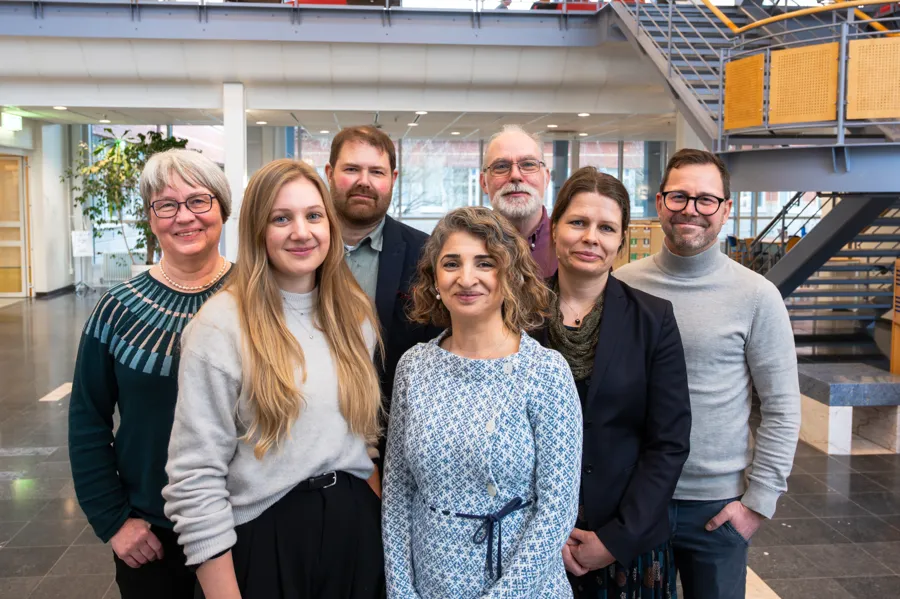 A group of people standing next to each other.