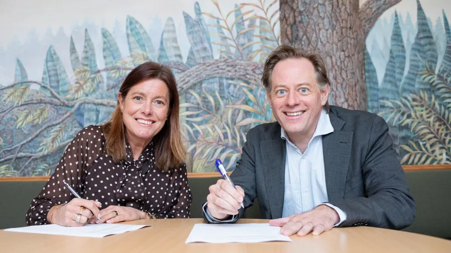 A man and a woman sitting at a table.