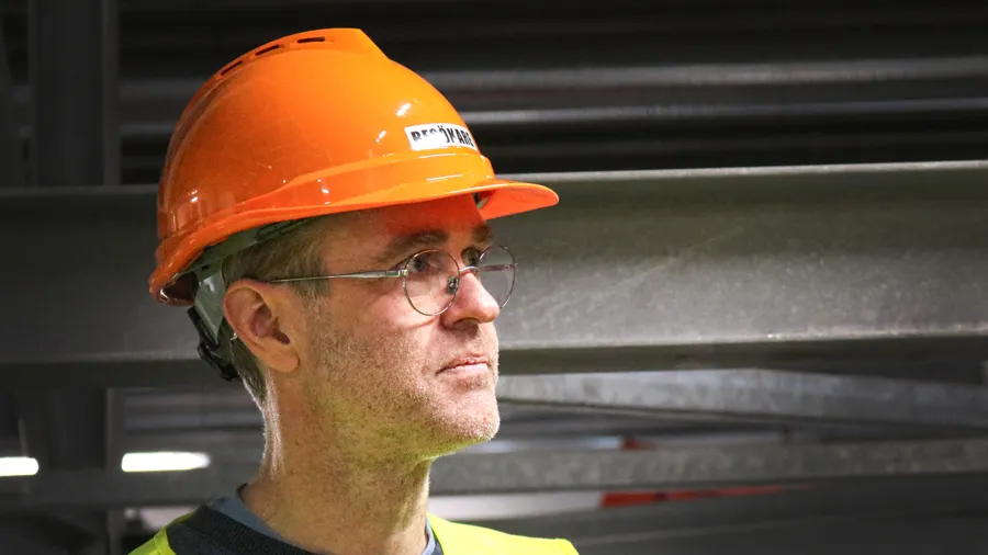 Man in orange helmet.