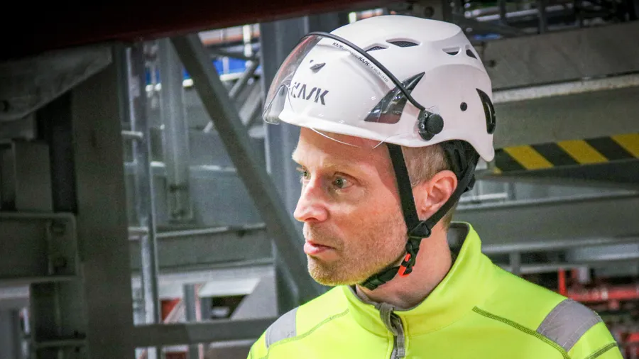 Man in white helmet.